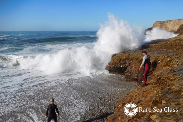 Waves crashing into the pit area at Davenport Beach showing the dangerous conditions sea glass hunters face